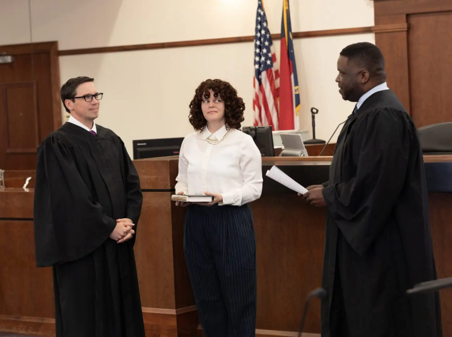 A couple of people in front of a judge.