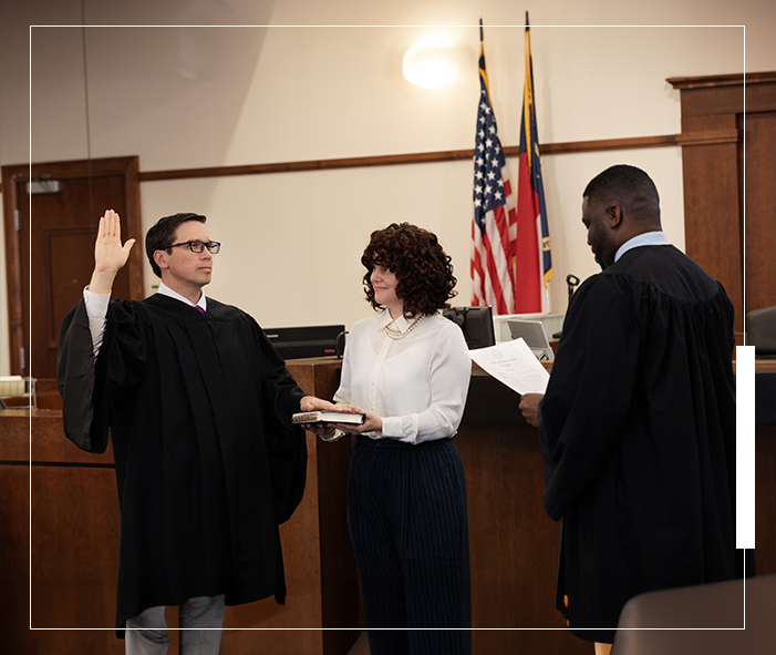 A judge is taking the oath of office.